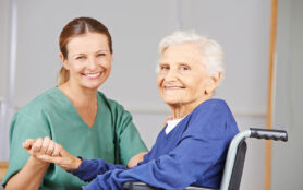 Geriatric,Nurse,And,Senior,Woman,In,Wheelchair,Smiling,Together,In
