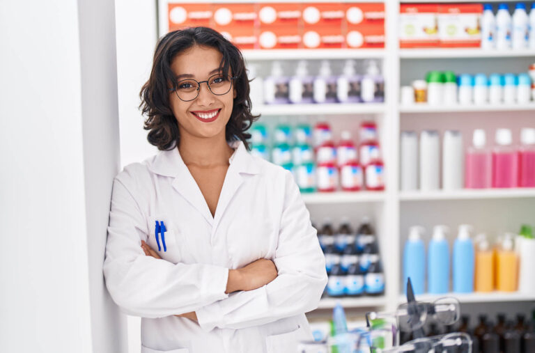 Young,Beautiful,Hispanic,Woman,Pharmacist,Smiling,Confident,Standing,With,Arms