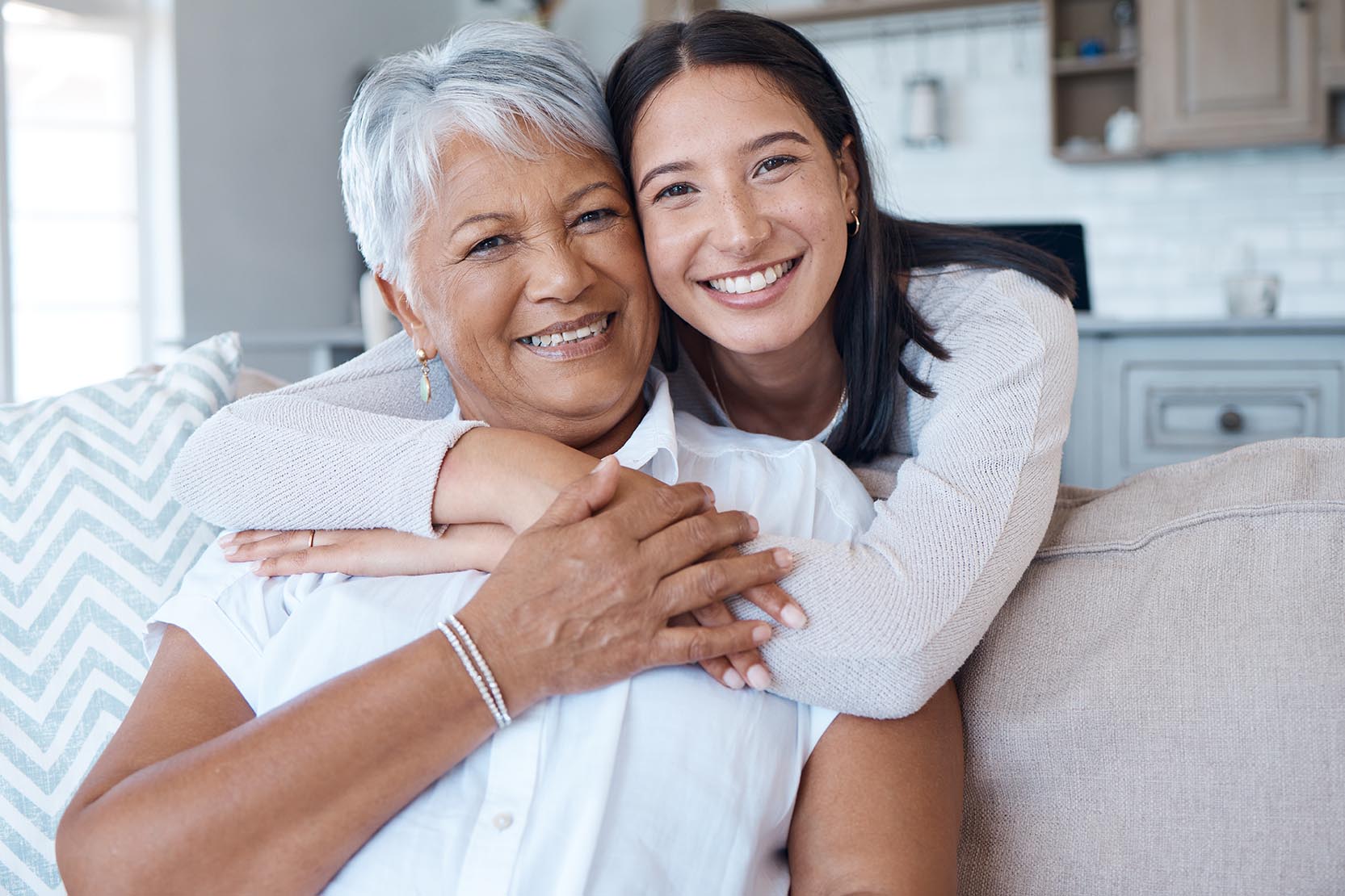 Hug,,Sofa,And,Portrait,Of,Women,Smile,For,Care,,Trust