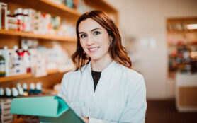 Young,Female,Pharmacist,Working,In,Her,Large,Pharmacy.,Placing,Medications,