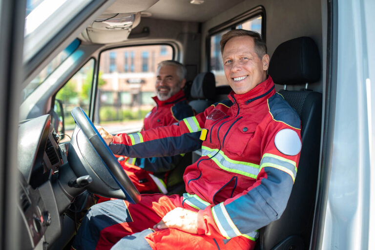 Paramedics,Posing,For,The,Camera,In,The,Medical,Emergency,Vehicle