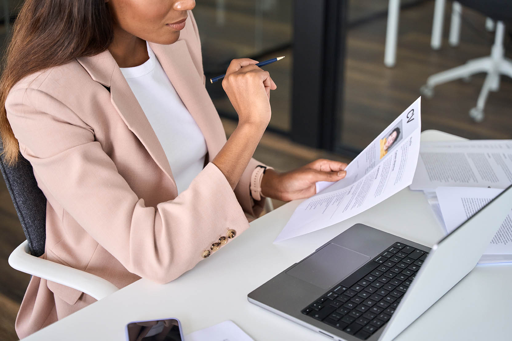 Close,Up,View,Of,Female,Hr,Manager,Reading,Cv,During