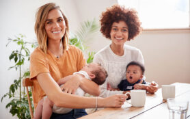 Portrait,Of,Two,Mothers,With,Babies,Meeting,Around,Table,On