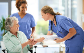 Shot,Of,An,Attractive,Female,Nurse,Holding,Medical,Records,While